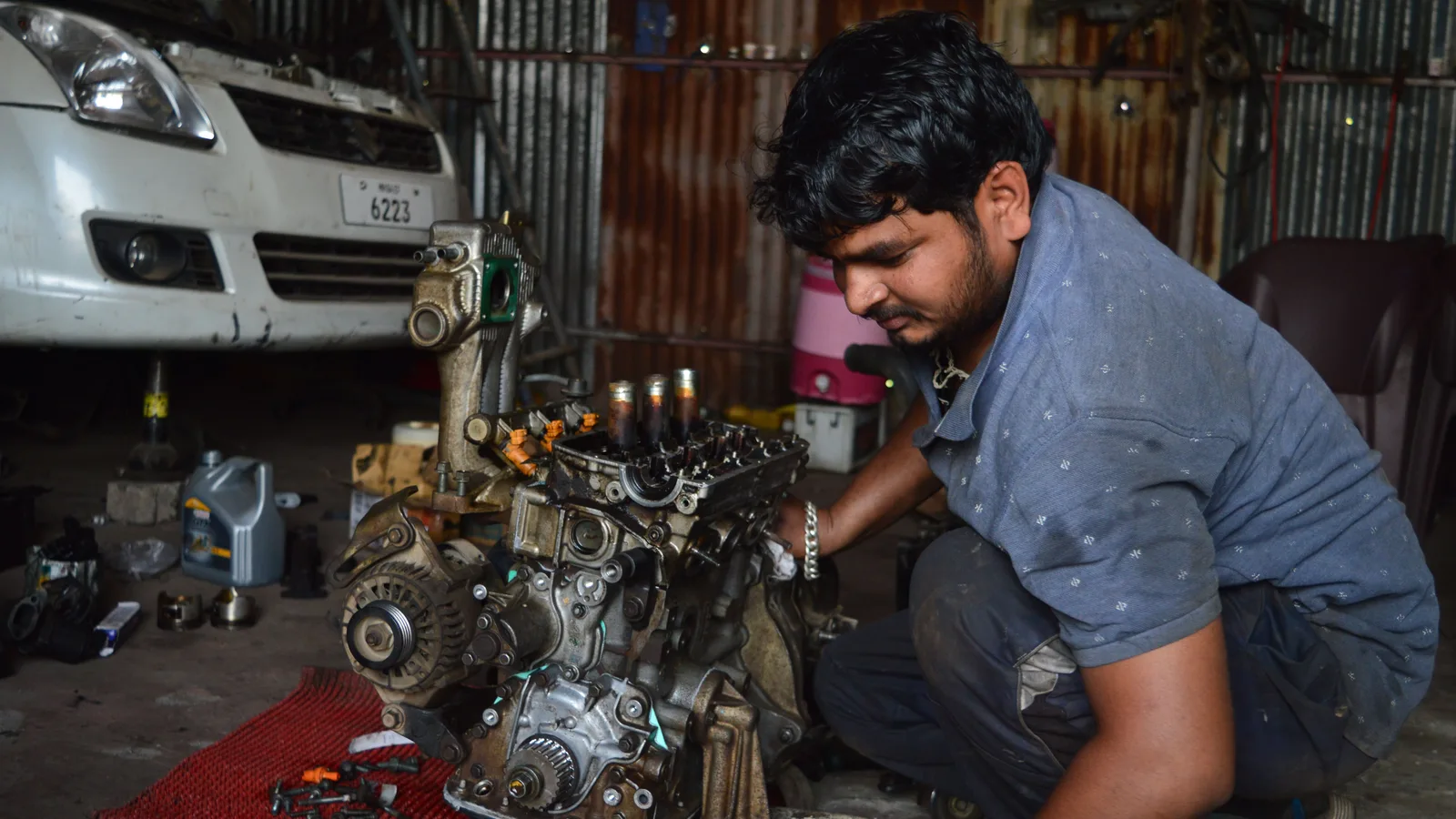 A technician with a machine opened up mid-service, not mid-failure