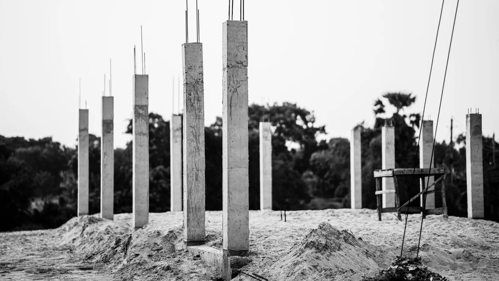 Steel reinforcement laid in a foundation trench before any structure goes up